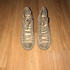 Lace up, and zipper block heel sandal.